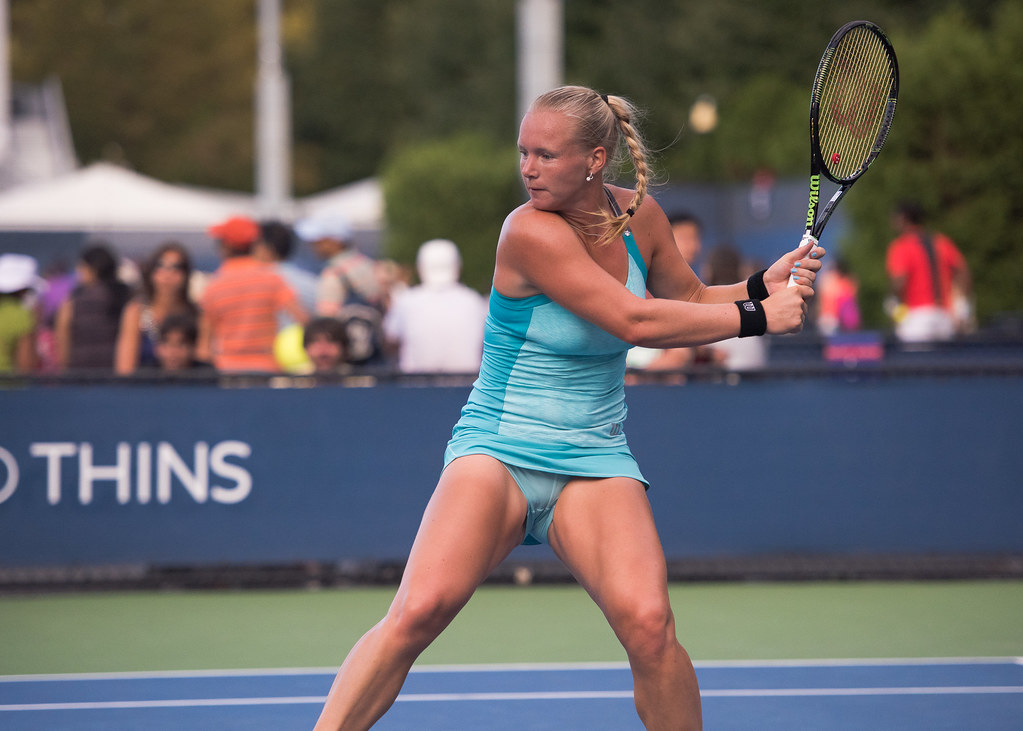Tennis player ripping a two-handed backhand